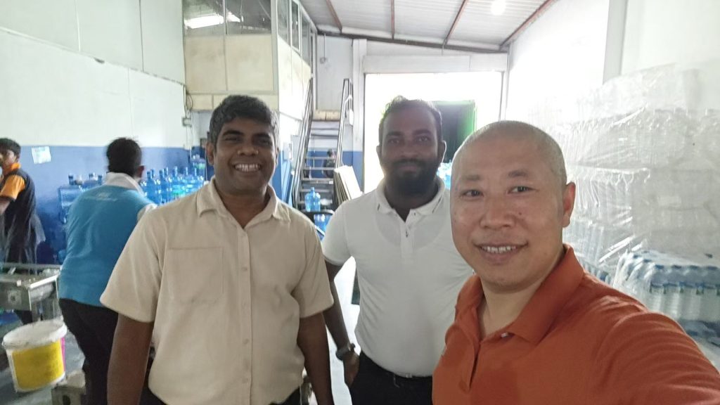 A group photo of TINGS engineers and the client