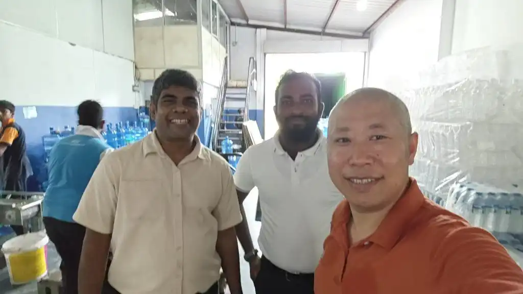 A group photo of TINGS engineers and the client