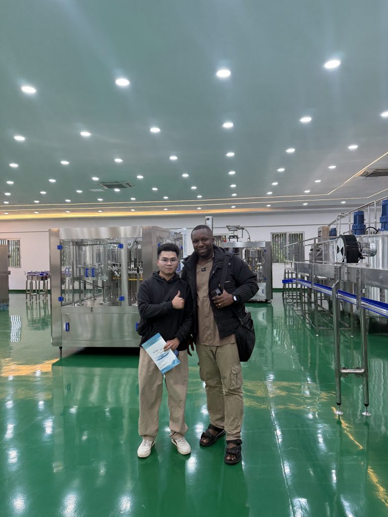 Group photo of customers touring the factory